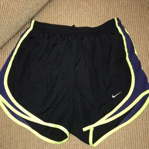 Black nike shores with neon and purple trim